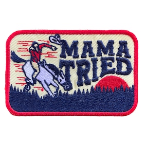 May include: A red, white, and blue embroidered patch with a cowboy riding a horse and the text "Mama Tried".