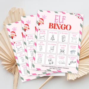 May include: Christmas-themed Elf Bingo game cards with a pink and green striped border. The cards feature illustrations of an elf and festive activities. The text "ELF BINGO" is in large red letters. The cards are designed for a fun holiday game.
