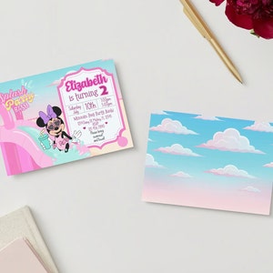 May include: A pink and blue invitation featuring a cartoon image of Minnie Mouse wearing sunglasses and holding a drink. The text on the invitation reads "Splash Party Bash" and "Elizabeth is turning 2".