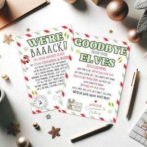 以下が含まれることがあります： 緑と赤のテキストが入った2枚のクリスマスをテーマにしたカード。1枚は「We're Baaack!」、もう1枚は「Goodbye from your Elves」と書かれています。カードには装飾的なボーダーとお祝いのイラストが描かれています。ペンや装飾品も写っています。