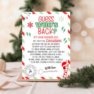 May include: A Christmas card with the text "Guess Who's Back?" in green and red. The card features a playful poem from "Cinnamon," an elf, with festive illustrations of snowflakes, candy canes, and a North Pole stamp.