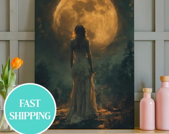 May include: A canvas print depicts a woman standing before a large, glowing moon. She wears a flowing, cream-colored dress. The background features a dark forest and a golden light. The print is displayed on a wooden surface.