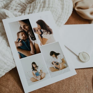 May include: A printed photo card featuring four images of a mother and baby. The card is white with a soft, matte finish. The images show the mother holding and interacting with the baby. The card is on a wooden surface.