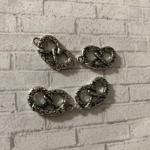 Antique silver pretzel charm