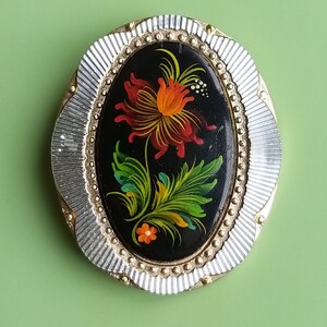 Vintage brooch with floral handmade painting. Old golden Brooch with floral ornament. Retro Style Painted Brooch