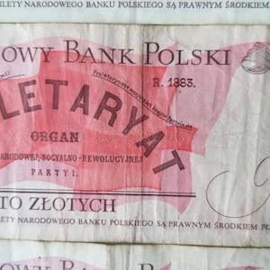May include: A vintage Polish banknote with a red and white design. The note features the text "Narodowy Bank Polski" and "Proletaryat" in black lettering. The note is dated "R. 1883." and has a value of "100 sto zlotych".