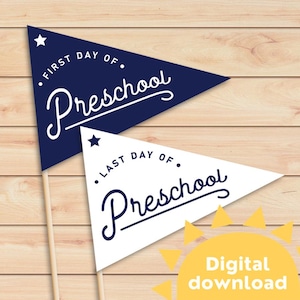 May include: Two blue and white pennant flags with the text "First Day of Preschool" and "Last Day of Preschool" in a white cursive font. The flags are on wooden sticks and are set against a woodgrain background. The text "Digital Download" is in yellow on a yellow sun graphic.