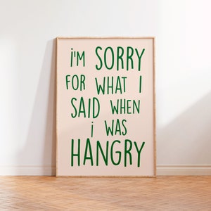 Può includere: Un poster incorniciato rosa con il testo "I'm sorry for what I said when I was hangry" in lettere verdi.