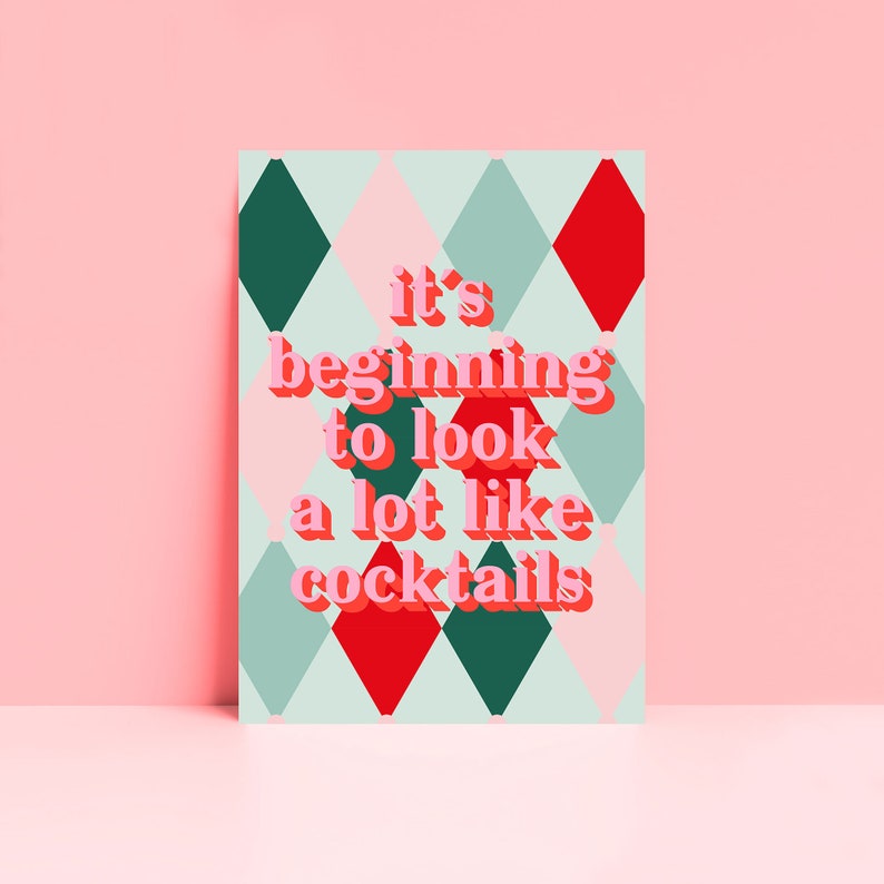 May include: A green, pink, and red diamond pattern background with the text "it's beginning to look a lot like cocktails" in pink letters.