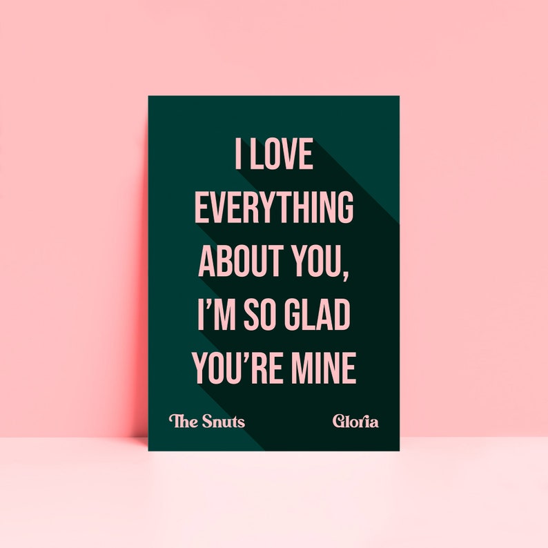 May include: A dark green poster with white text that reads "I love everything about you, I'm so glad you're mine." The poster also has the text "The Snuts" and "Gloria" in pink.