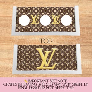 May include: Two rectangular shelves with a brown and tan pattern and gold accents. The top shelf has three circular cutouts. The bottom shelf features a large gold "V" logo. The word "TOP" is printed on the image.
