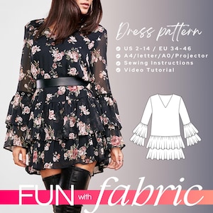 May include: A dress pattern for sizes US 2-14 or EU 34-46. The pattern includes instructions for sewing and a video tutorial. The pattern is for a dress with a V-neck, long sleeves, and a tiered skirt. The dress is shown on a model wearing a black floral dress with a similar style.