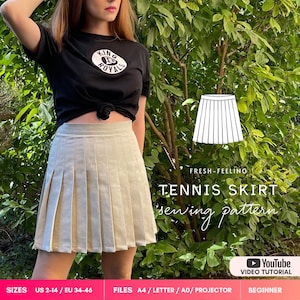 May include: A beige pleated tennis skirt with a high waistband. The image includes a white line drawing of the skirt, the text "FRESH-FEELING TENNIS SKIRT sewing pattern", a YouTube icon with "VIDEO TUTORIAL", and size text "US 2-14 / EU 34-46".