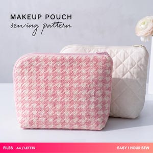 May include: A makeup pouch sewing pattern featuring two zippered pouches. One pouch has a pink and white houndstooth fabric pattern, and the other is a solid off-white quilted fabric. The text reads MAKEUP POUCH sewing pattern, FILES A4 / LETTER.