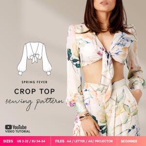 May include: A sewing pattern for a long-sleeved crop top with a front tie closure, featuring a floral print. The image includes a technical line drawing of the top, the text SPRING FEVER CROP TOP sewing pattern, and size information US 2-22.