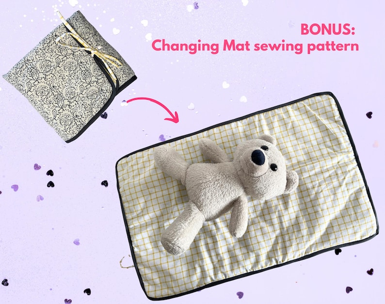 May include: A folded fabric square with a black and white floral pattern tied with a gold ribbon, and a rectangular changing mat with a yellow and white grid pattern featuring a plush teddy bear, with text reading BONUS: Changing Mat sewing pattern.