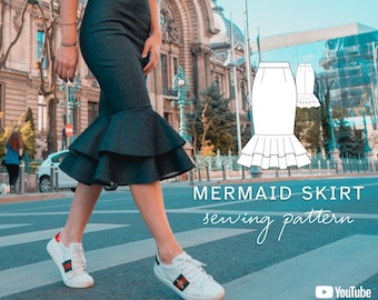 May include: A dark denim mermaid skirt with a high waist and a double-tiered ruffled hem. The image includes a white line drawing of the skirt pattern, the text MERMAID SKIRT sewing pattern, and a YouTube video tutorial icon with size info.