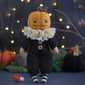 Spooky Mr. Pumpkin Halloween crochet pattern in black jumpsuit and a collar. Halloween pumpkin doll. Halloween decor.