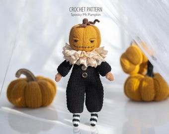May include: A handmade crochet doll with a pumpkin head, wearing a black outfit with a ruffled collar and striped socks. The doll has a stitched face and is accompanied by two crochet pumpkins. The text "CROCHET PATTERN Spooky Mr. Pumpkin" is visible.