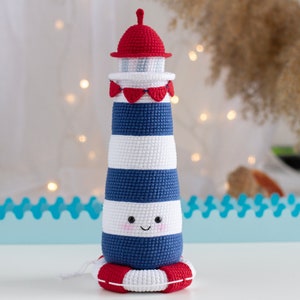 Lighthouse PDF crochet pattern. Cute lighthouse with white and navy stripes, red roof and lifebuoy.