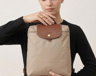 Zaino vintage Longchamp Le Pliage beige, in nylon e pelle, ideale per viaggi.