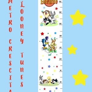 May include: A Looney Tunes themed height chart with the name "Edoardo" at the top. The chart features cartoon characters, a measuring scale, and colorful stars against a light blue background. The height chart measures up to 150 inches.