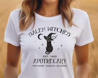 Maglietta Salem Witches Apothecary, Maglietta Black Cat, Maglietta Salem Witch Trials, Maglietta VooDoo, Maglietta Salem Witch 1692, Maglietta Cute Witch