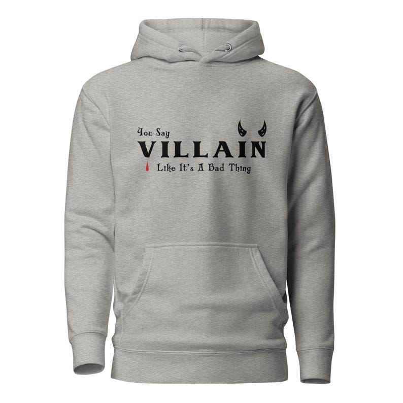An athletic grey You Say Villain Like Its A Bad Thing hoodie with cute devil horns created by graphic apparel company Midnight Gypsy Designs as part of their Dark Academia clothing and Bookish Merch clothing line.