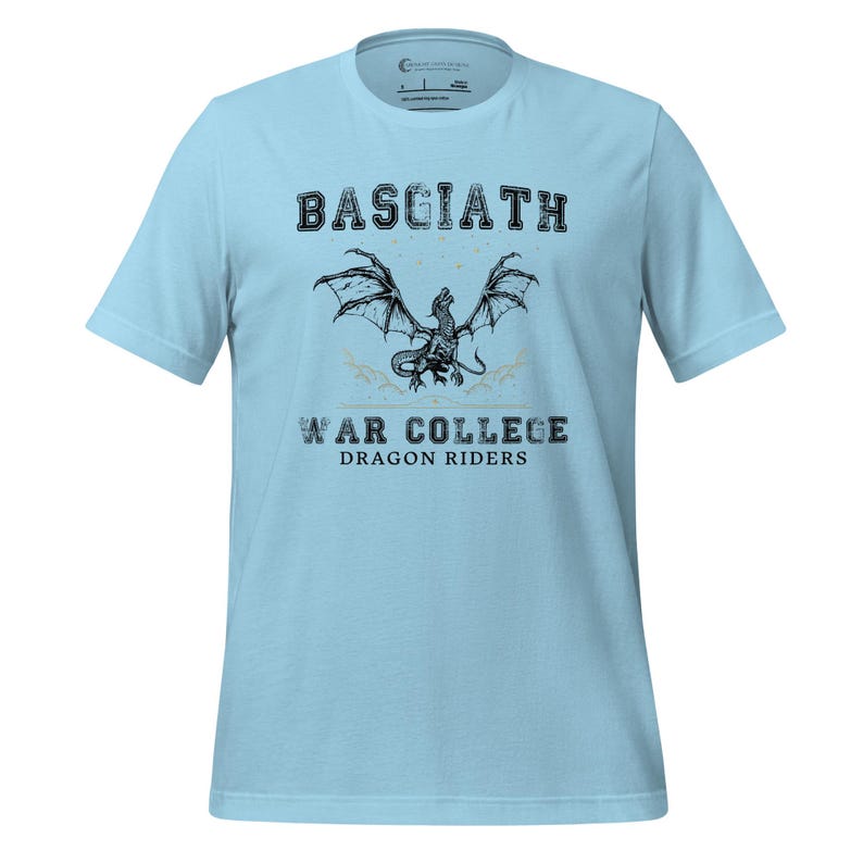 May include: Light blue t-shirt with a black and white illustration of a dragon. The text "Basciath War College Dragon Riders" is printed on the shirt.