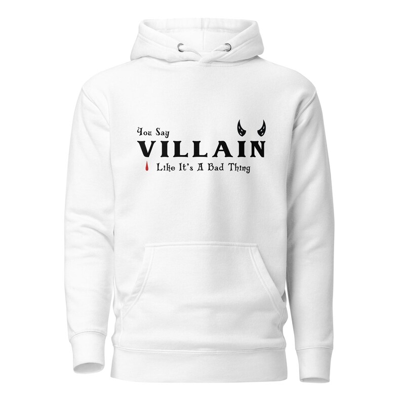 A white You Say Villain Like Its A Bad Thing hoodie with cute devil horns created by graphic apparel company Midnight Gypsy Designs as part of their Dark Academia clothing and Bookish Merch clothing line.