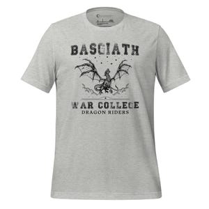 May include: A gray t-shirt with a black and white graphic of a dragon with the text "Basgiath War College Dragon Riders".