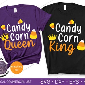May include: A set of two purple and black t-shirts with a Halloween theme. The purple shirt says "Candy Corn Queen" with a crown and candy corn graphic. The black shirt says "Candy Corn King" with a crown and candy corn graphic.