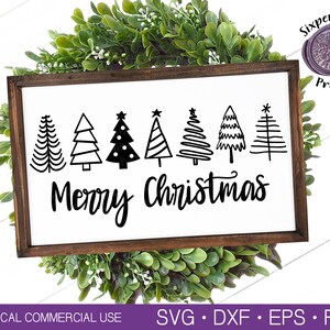 May include: A white wooden sign with the text "Merry Christmas" in black cursive lettering.  The sign is decorated with seven black silhouette Christmas trees.