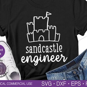 May include: Black t-shirt with a white sandcastle graphic and the text "sandcastle engineer".