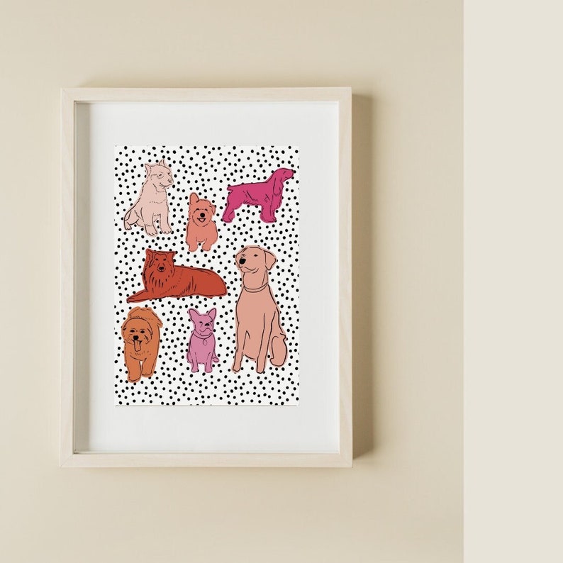 May include: A framed print with a white background and black polka dots. The print features a collection of colorful line drawings of dogs in various poses.
