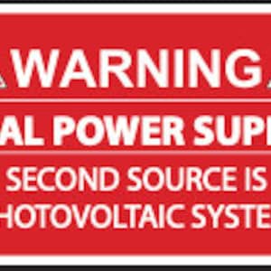 May include: Red warning sign with a lightning bolt symbol on each side. The sign reads "WARNING DUAL POWER SUPPLY SECOND SOURCE IS PHOTOVOLTAIC SYSTEM."