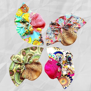 May include: Four colorful sun hats with different patterned fabrics and crocheted brims. The hats are arranged in a circle on a white background.
