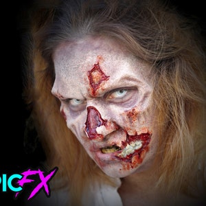 May include: Close-up of a woman's face with realistic zombie makeup. The makeup includes pale skin, red and white blood, and a cracked and broken skull effect.