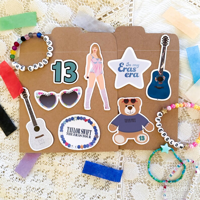 May include: A collection of Taylor Swift themed stickers and bracelets. The stickers include a guitar, sunglasses, a teddy bear, a star with the text "In my Eras era", and a circle with the text "Taylor Swift The Eras Tour". The bracelets are made of colorful beads and have the text "The Eras Tour", "Afterglow", and "13".