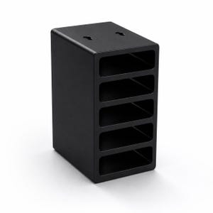 May include: A matte black vertical storage organiser featuring five rectangular open compartments stacked in a column. The top surface includes two keyhole-shaped mounting slots, and the unit has a solid, rectangular frame with rounded edges.