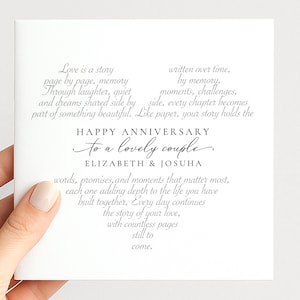May include: A square white anniversary greeting card featuring black and grey printed text. The card reads: Love is a story written over time, page by page, memory by memory. HAPPY ANNIVERSARY TO A LOVELY COUPLE ELIZABETH & JOSUHA words, promises, and moments.