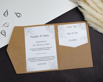 Pode incluir: Um convite de casamento em papel kraft com um inserto branco com desenhos florais e o texto "Stephie & Patric" e "JUAL WIR SAGEN JAN AM 23. JUN 2025 IST ES SOWEITI". O convite tem um bolso do lado direito com um inserto branco com desenhos florais e o texto "Unser Tag", "Dies & Das" e "Kontakte".