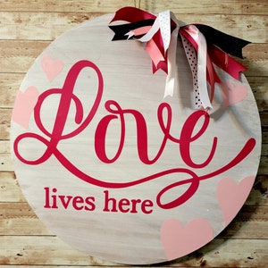 Love Lives Here Door Hanger 18 inch Birch Round