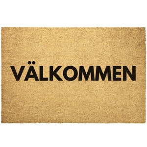 May include: A brown coir doormat with the text "VÄLKOMMEN" in black lettering.