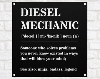 May include: Black metal sign with white text that reads "DIESEL MECHANIC ['de-zel ][ mi- 'ka-nik ] noun (n) Someone who solves problems you never knew existed in ways that will blow your mind; See also: ninja; badass; legend"