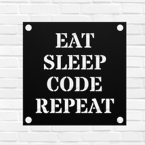 May include: Black metal sign with the words "EAT SLEEP CODE REPEAT" in white, stencil-style lettering. The sign is square with a white dot in each corner. The sign is mounted on a white brick wall.