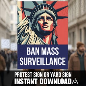 May include: A rectangular protest sign featuring a stylised graphic of the Statue of Liberty in red, white, and blue tones. Below the image, a dark blue rectangular field contains the white text BAN MASS SURVEILLANCE in bold capital letters.