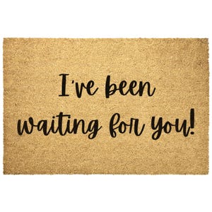 May include: A brown coir doormat with the text "I've been waiting for you!" in black lettering.