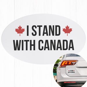 May include: White oval sticker with the text "I STAND WITH CANADA" in black, flanked by red maple leaf symbols. A smaller version of the sticker is shown on the back of a white car.