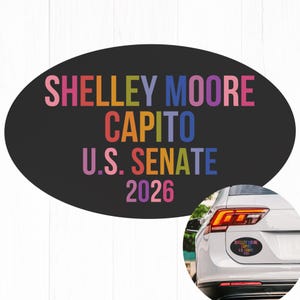 May include: An oval bumper sticker with the text "SHELLEY MOORE CAPITO U.S. SENATE 2026" in rainbow colors on a black background. A car with the same sticker is shown in the lower right corner.